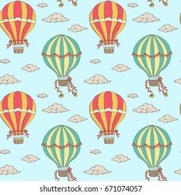 Hand drawn retro seamless pattern. Hot air balloons and clouds on light blue background
