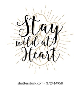 Hand drawn romantic poster with human heart and inspiring lettering and star burst. Stay wild at heart.