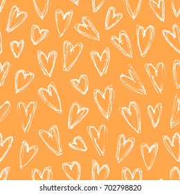 Hand drawn romantic seamless pattern. Female background. Orange abstract  doodle drawing. Vector art illustration hearts