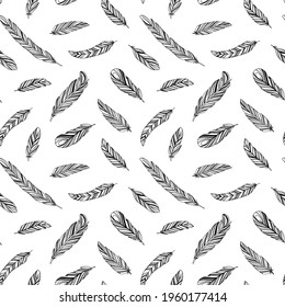 Hand drawn rustic ethnic decorative feathers. Vector seamless pattern. Tribal bird feathers ornament. Vector ink illustration isolated on white background. Ethnic boho style hand drawing