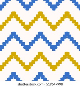 Hand drawn seamless chevron pattern in blue, yellow and cream. Modern textile, wall art, wrapping paper, wallpaper design.
