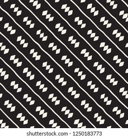Hand drawn seamless pattern. Abstract geometric shapes background in black and white. Vector ethnic style grungy texture.
