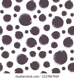 Hand drawn seamless pattern with black polka dots. Dry brush ink illustration. Abstract vector background.