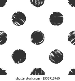 Hand drawn seamless pattern with black polka dots. Dry brush ink illustration. Abstract vector background.