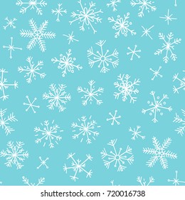 Hand drawn seamless pattern. Blue on white background. Abstract  doodle drawing snowflake. Vector art illustration snow