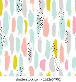Hand drawn seamless pattern with brush strokes in black and pastel colors.