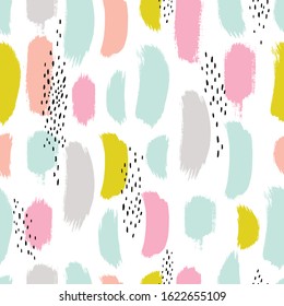 Hand drawn seamless pattern with brush strokes in black and pastel colors.