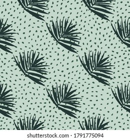 Hand drawn seamless pattern with bush leaves. Light green background with dots and dark green tropical foliage ornament. Great for wrapping, textile, fabric print and wallpaper. Vector illustration.