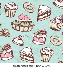 Hand drawn seamless pattern with candies and cakes in vintage style. Vector green background with sweets.