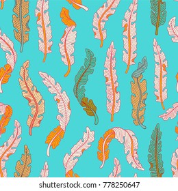 Hand drawn seamless pattern with colorful tropical banana leaves on light blue background. Hand drawn jungle texture. Ornate vector background for print, interior, wallpaper, fabrics