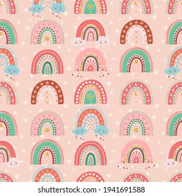 Hand drawn seamless pattern of cute rainbows with star, heart, cloud, moon. Colorful adorable doodle sketch illustration for greeting card, invitation, wallpaper, wrapping paper, fabric, baby room