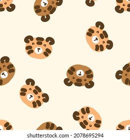 Hand drawn seamless pattern with cute tiger faces. Perfect for T-shirt, textile and print. Doodle vector illustration for decor and design.
