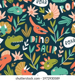 Hand drawn seamless pattern with dinosaurs and tropical leaves and lettering. Perfect for kids fabric, textile, nursery wallpaper. Cute baby dino design. Vector illustration.
