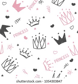 Hand drawn seamless pattern with doodle crowns. Cute baby and little princess design. Children's room wallpaper and clothes texture.
