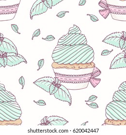 Hand drawn seamless pattern with doodle cupcake and mint buttercream. Food background
