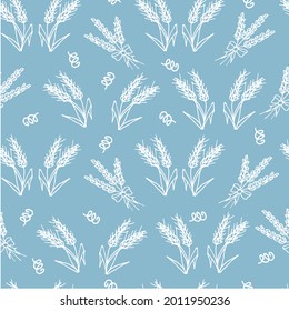 Hand drawn seamless pattern with ears of wheat on a blue background. For textiles, notebook covers, cards and other printed products. Vector illustration. 