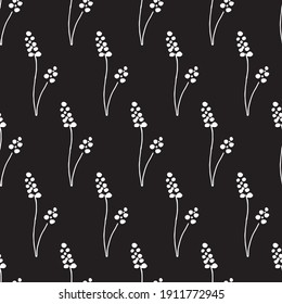 Hand drawn seamless pattern of elements. Floral background for concept design, wedding invitation, t-shirt, notebooks, textile, hipster pattern. White flowers at black background.