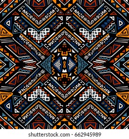 Hand drawn seamless pattern with ethnic aztec motives. Bright colored abstract wallpaper in boho style.