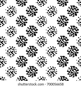 Hand drawn seamless pattern isolated on white. Endless vector primitive background with black dots. Stylish monochrome doodles. Polka dot texture. Vector illustration.