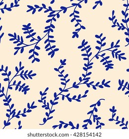 Hand drawn seamless pattern with leaf branches in indigo blue.