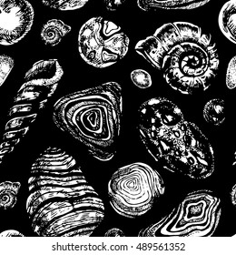 Hand drawn seamless pattern made of pebbles and shells isolated on black. Vector ink illustration in engraving style. Rustic, boho, grunge, nautical.