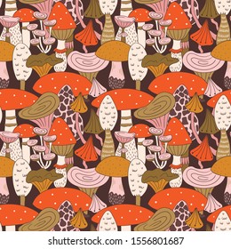 Hand drawn seamless pattern of mushroom and toadstools. Vector illustration for fabric or wrap paper design.