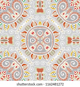 Hand drawn seamless pattern, repeating texture for textile fabric or paper print. Colorful doodle background with geometric and floral elements. Tribal ethnic mandala ornament for interior decoration