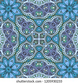 Hand drawn seamless pattern, repeating texture for textile fabric or paper print. Colorful doodle background with geometric and floral elements. Tribal ethnic mandala ornament for interior decoration