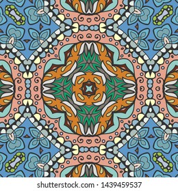 Hand drawn seamless pattern, repeating texture for textile fabric print. Colorful doodle background with geometric and floral elements. Tribal ethnic mandala ornament for scarf, shawl, hijab design