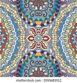 Hand drawn seamless pattern, repeating texture for textile fabric print. Colorful doodle background with geometric and floral elements. Tribal ethnic mandala ornament for scarf, shawl, hijab design