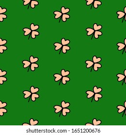 Diseño manual sin fisuras símbolo tradicional beige del Día de San Patricio   ilustración vectorial de trébol aislada en fondo verde.Diseñar mejor para envolver, textil, papel tapiz, papel de saludo