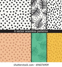 Hand drawn seamless pattern set of hearts, branch and specks.