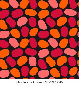 Hand drawn seamless pattern with spots in red-orange tones. Abstract autumn background from multicolored pebbles. Stylized texture for fabric, textile, apparel, products, design. Vector illustration.