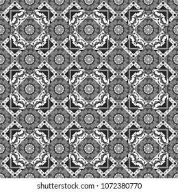 Hand drawn seamless pattern. For textile, wallpaper, wrapping paper. Zigzag and stripe line, rhombus and tiles. Vector tribal design in gray, black and white colors. Ethnic theme.