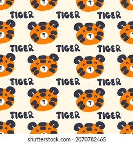 Hand drawn seamless pattern with tiger faces and text TIGER. Perfect for T-shirt, textile and print. Doodle vector illustration for decor and design.

