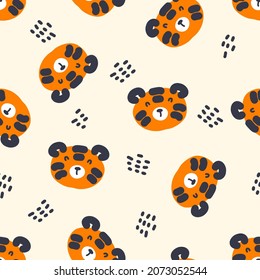 Hand drawn seamless pattern with tiger faces and dots. Perfect for T-shirt, textile and print. Doodle vector illustration for decor and design.
