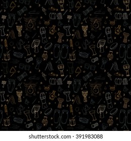 Hand drawn seamless pattern with traditional ethnic drums and percussion instruments. Doodles in pale orange, brown, gray colors on black background. EPS 10.