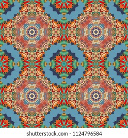 Hand drawn seamless pattern. Tribal design in violet, blue and pink colors. Zigzag and stripe line, rhombus and tiles. Ethnic theme. For textile, wallpaper, wrapping paper.