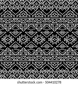 Hand drawn seamless pattern with tribal aztec motives. Black and white abstract wallpaper in boho style.