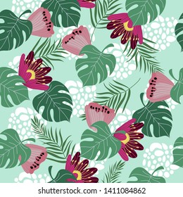 Hand drawn seamless pattern with tropical leaves and flowers on blue background. Vector flat illustration