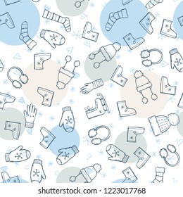 Hand drawn seamless pattern of winter clothes and accessory: hat, scarf, coat, mitten, shoes, sweater. Sketch style doodle for children, christmas wallpaper, background. Isolated vector illustration.