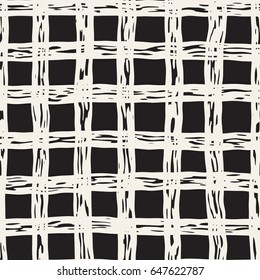 Hand drawn seamless plaid pattern. Allover pattern with ink doodle grunge grid. Graphic background with freehand line tartan.
