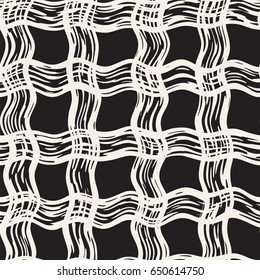 Hand drawn seamless plaid pattern. Allover pattern with ink doodle grunge grid. Graphic background with freehand line tartan.