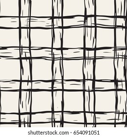 Hand drawn seamless plaid pattern. Allover pattern with ink doodle grunge grid. Graphic background with freehand line tartan.