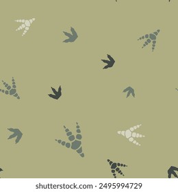 Hand drawn seamless repeat pattern with birds footprint in black and white. on green background.