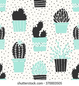 Hand drawn seamless repeat pattern with succulent plants in black, white and turquoise blue.