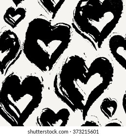 Hand drawn seamless repeat pattern with hearts in black on cream background. Modern and stylish romantic design poster, wrapping paper, Valentine card design.