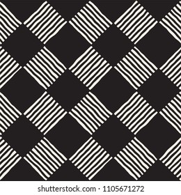 Hand drawn seamless repeating pattern with checker lines tiling. Grungy freehand ink brush background texture.