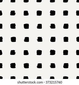 Hand drawn seamless repeating pattern with square shaped brush strokes in black and cream.