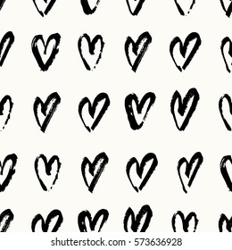 Hand drawn seamless repeating pattern with hearts in black and cream. Modern and stylish romantic design poster, wrapping paper, Valentine card design.